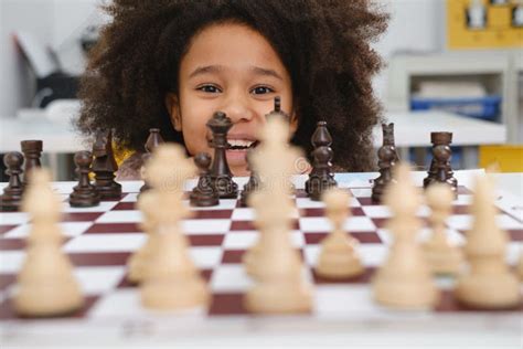 African American Girl Playing Chess Stock Photo - Image of childhood ...