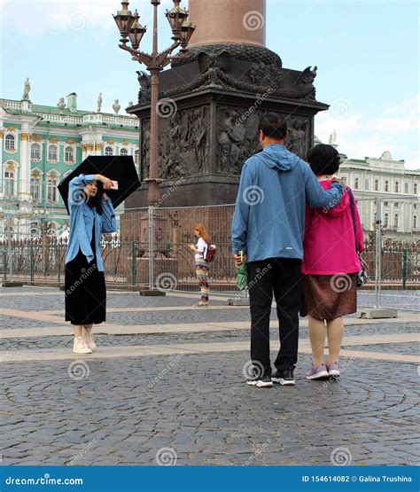 Photographing Tourists at the Palace Square Editorial Photography
