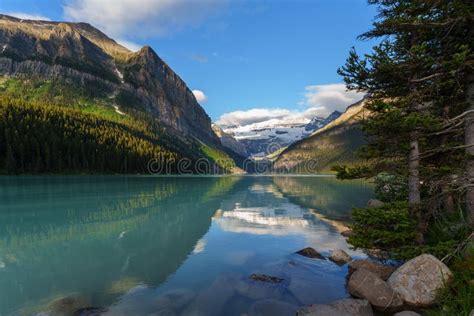 Stunning Mountain Setting Of Lake Louise With Reflection Of Soaring