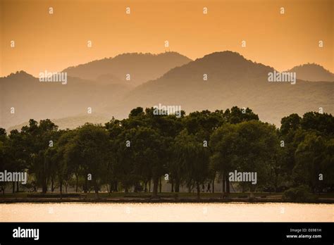 Hills at West Lake at sunset, Xihu, Hangzhou, Zhejiang Province, China ...