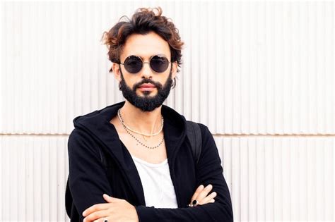 Premium Photo Portrait Of A Young Man With Beard And Sunglasses