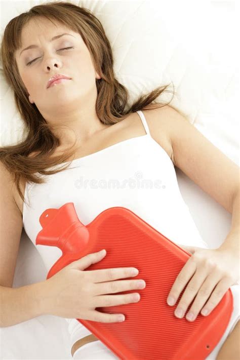 Woman Lying In Bed With Hot Water Bottle On Her Stomach Stock Image Image Of Healthiness