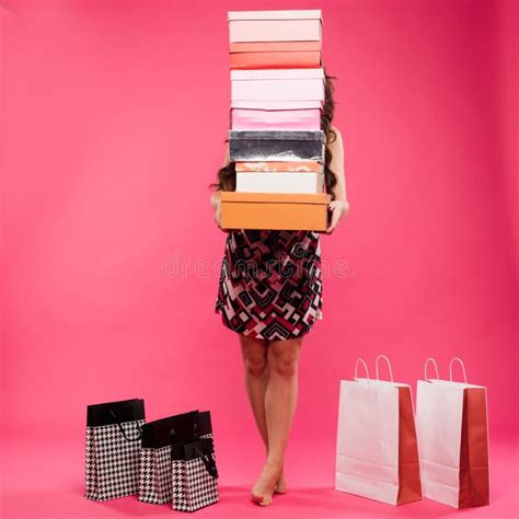 Beautiful Young Woman with Shopping Bags and Boxes Isolated on Pink ... 