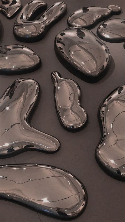 Many Shiny Objects Are Laying On The Floor Together In This Artistic