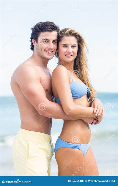 Happy Couple in Swimsuit Looking at Camera and Embracing Stock Photo ...