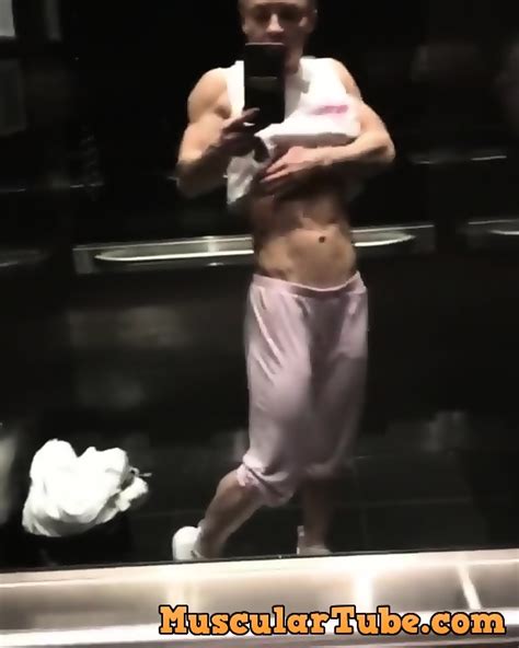 Stunning Blonde Muscle Woman Admires Herself In Elevator Mirror