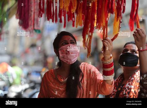 Indian Women Wear Face Masks And Shop For Rakhi Or A Sacred Thread