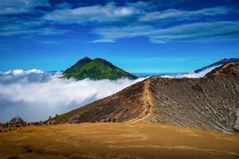 Premium Photo Landscape Of Mountains Amount Fog In Kawah Ijen Volcano