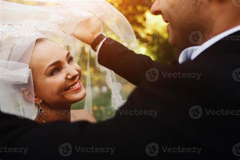 The Groom Lifts The Veil From The Bride 11443626 Stock Photo At Vecteezy