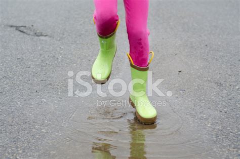 Boots Jumping IN Rain Puddle stock photos - FreeImages.com