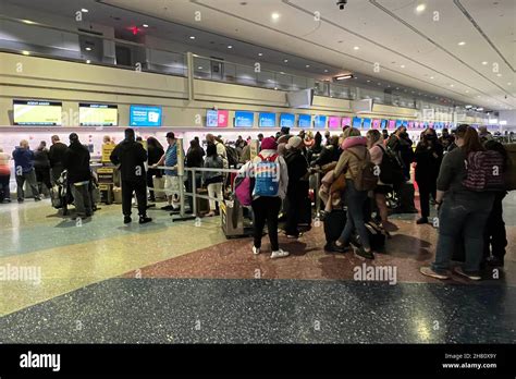 Passengers Stand In Line At The Spirit Airlines Ticket And Baggage