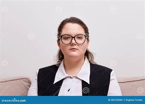 Portrait Of A Young Beautiful Brunette Woman With Black Rimmed Glasses