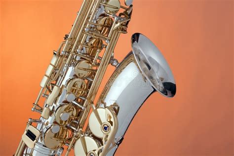 Alto Saxophone Isolated On Orange Stock Photo - Image: 12573490