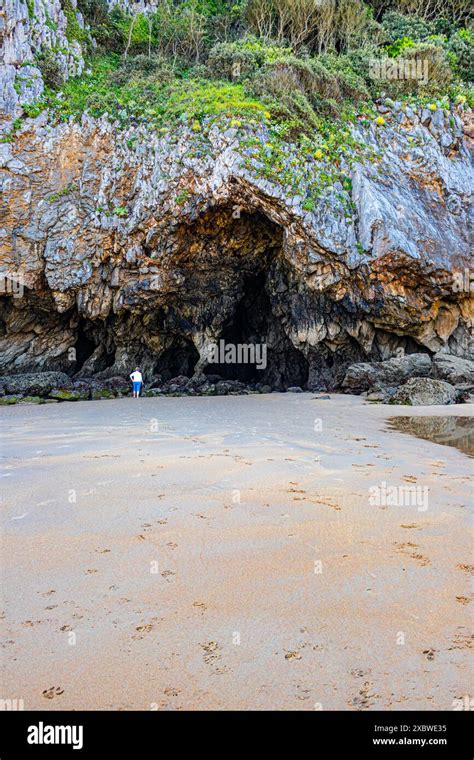 Caves at the eastern end of the Playa De Berria beach, Santona, Cantabria, Spain on the Atlantic ...