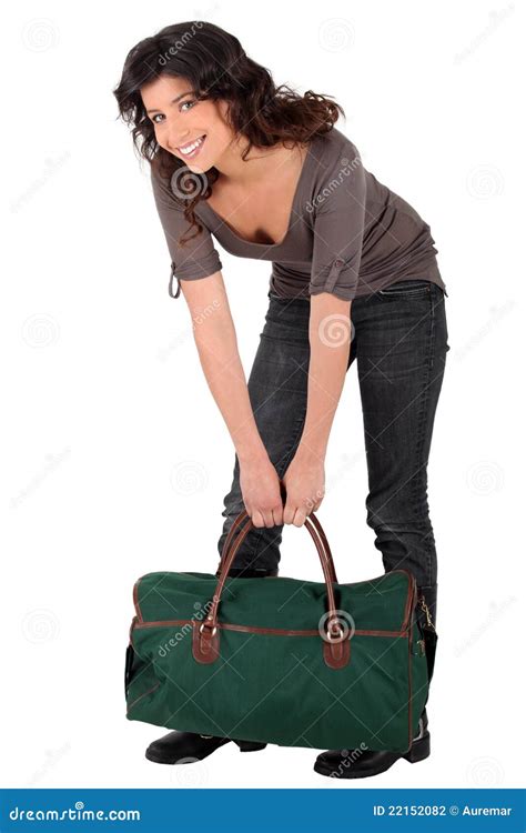 Woman lifting heavy bag stock photo. Image of appealing - 22152082