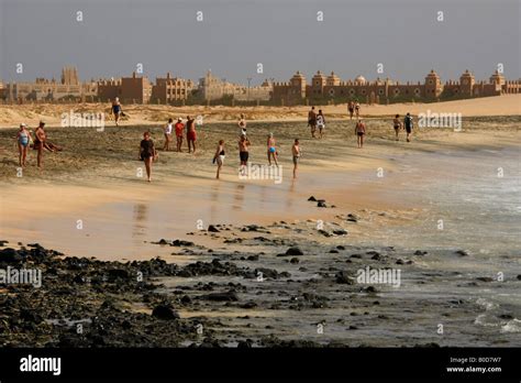 tourists at the beach in front of the giant Riu Funana Garopa hotels Sal island Stock Photo - Alamy