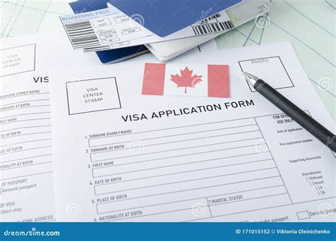 Concept Of Getting Canadian Visa Blank Visa Application Form Pen Passports Tickets And