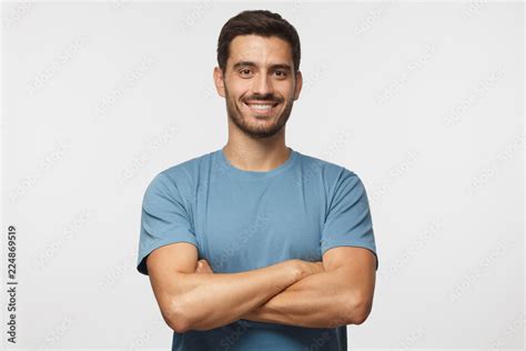 Indoor Portrait Of Young European Caucasian Man Isolated On Gray