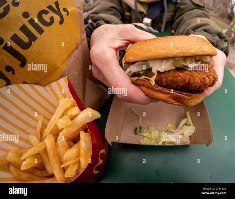 Mcdonalds deluxe crispy chicken sandwich meal hi-res stock photography ...