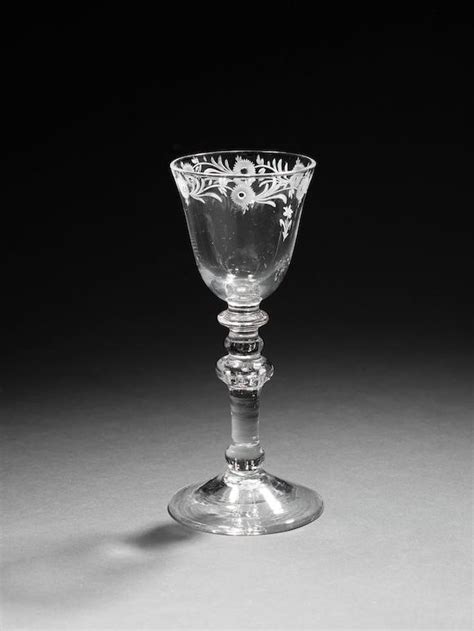 Bonhams A Dutch Engraved Light Baluster Trick Wine Glass Circa 1760