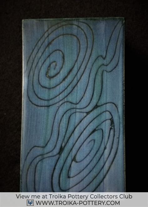 a piece of wood that has been carved into the shape of a spiral design on it