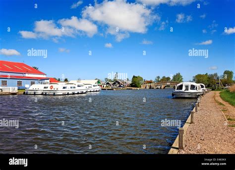 A View Of The River Thurne And The Medieval Bridge On The Norfolk