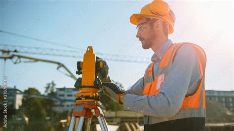 Construction Worker Using Theodolite Surveying Optical Instrument For