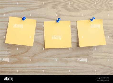 Three Yellow Paper Notes Mockup Pinned To Wooden Bulletin Board Sticky Notes On Bulletin Board