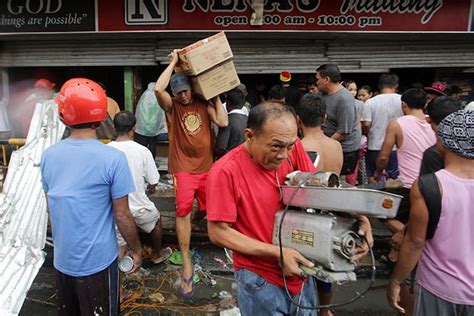 Tormented typhoon victims scour for food