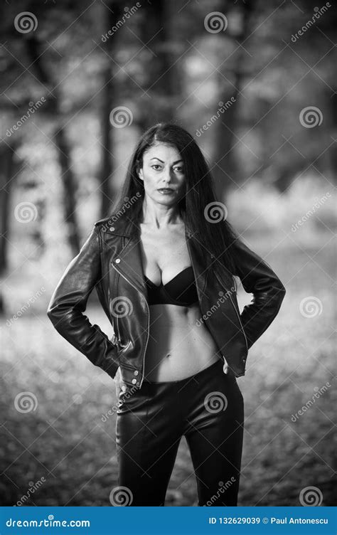 Beautiful Dark Haired Young Woman Wearing A Black Bra Leather Jacket