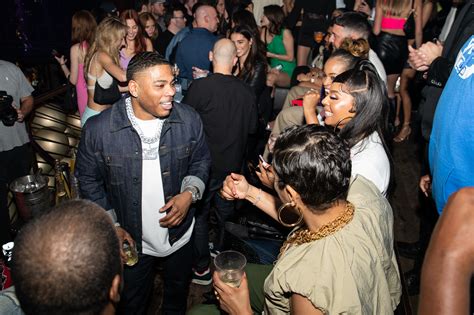 Exclusive | Nelly, Ashanti continue to fuel romance rumors at private party