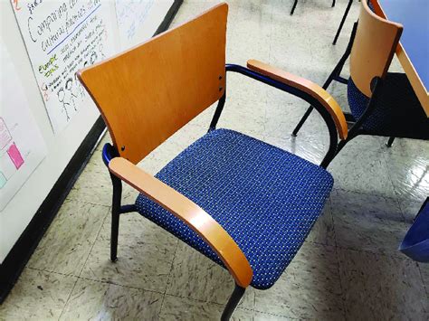 A Photo of a Metal Chair With Wooden Arms in a Classroom (Photo From ...