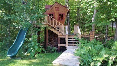 Crooked Playhouse Elevated On Stilts With Deck Play Houses Backyard Backyard Spaces