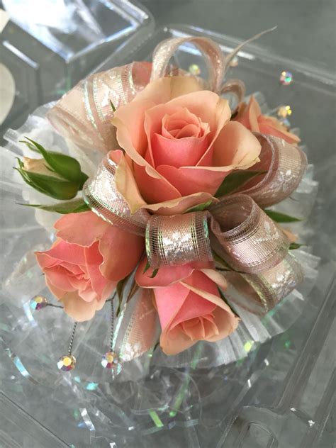 Wristlet Corsage With Peachy Pink Spray Roses Peach Textured Ribbon