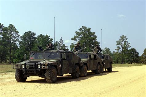 High Mobility Multipurpose Wheeled Vehicles HMMWV Are Lined Up While