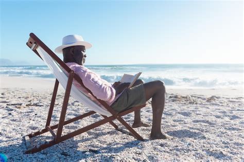 Premium Photo Side View Of African American Senior Man Reading Book