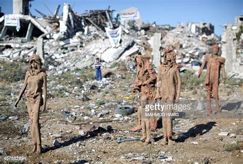 Statues By Palestinian Artist Eyad Sabbah Stand Amidst The Rubble Of News Photo Getty Images