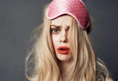 Premium Photo Portrait Of A Blonde In A Sleep Mask And Bright Makeup Lipstick Smeared On Her Face
