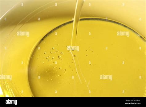 Pouring Cooking Oil Into Glass Bowl Closeup Stock Photo Alamy