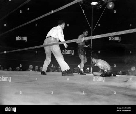 World Heavyweight Champion Joe Louis Stands Over Challenger Billy Conn