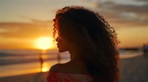 Premium Photo | Back view portrait of a black female with sunset on the ...