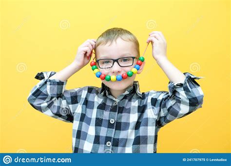 Development Of Fine Motor Skills Toddler Boy Is Stringing Beads On A