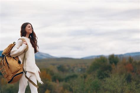 Premium Photo | Adventure smiling mountain woman enjoying a stylish ...