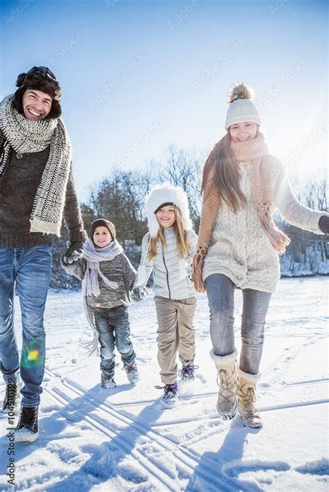 Happy family holding hands Stock Photo | Adobe Stock