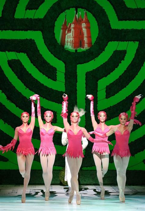 Four Ballerinas In Pink Are Dancing On Stage