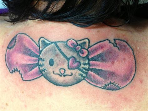Hello Kitty Bow On Shoulder Tattoos