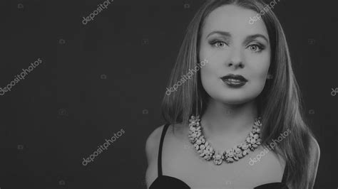 Sexy Brunette In An Elegant Dress On A Dark Background Stock Photo By Aallm