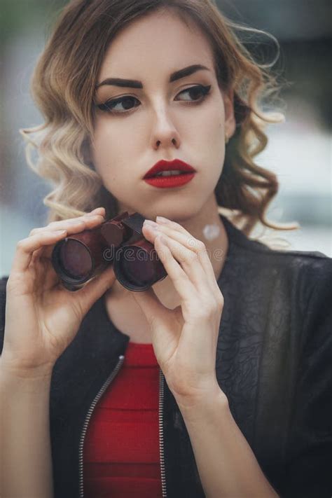 Beautiful Brunette Spy Agent Killer Or Police Woman In Leather Jacket And Red Luxury Dress With