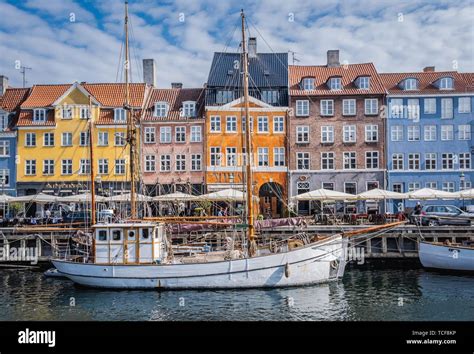 Sailing Boats On The Canal In Front Of Colorful Facades Nyhavn