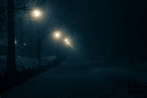 Lighted Street Lamps of a Snow Covered Street · Free Stock Photo